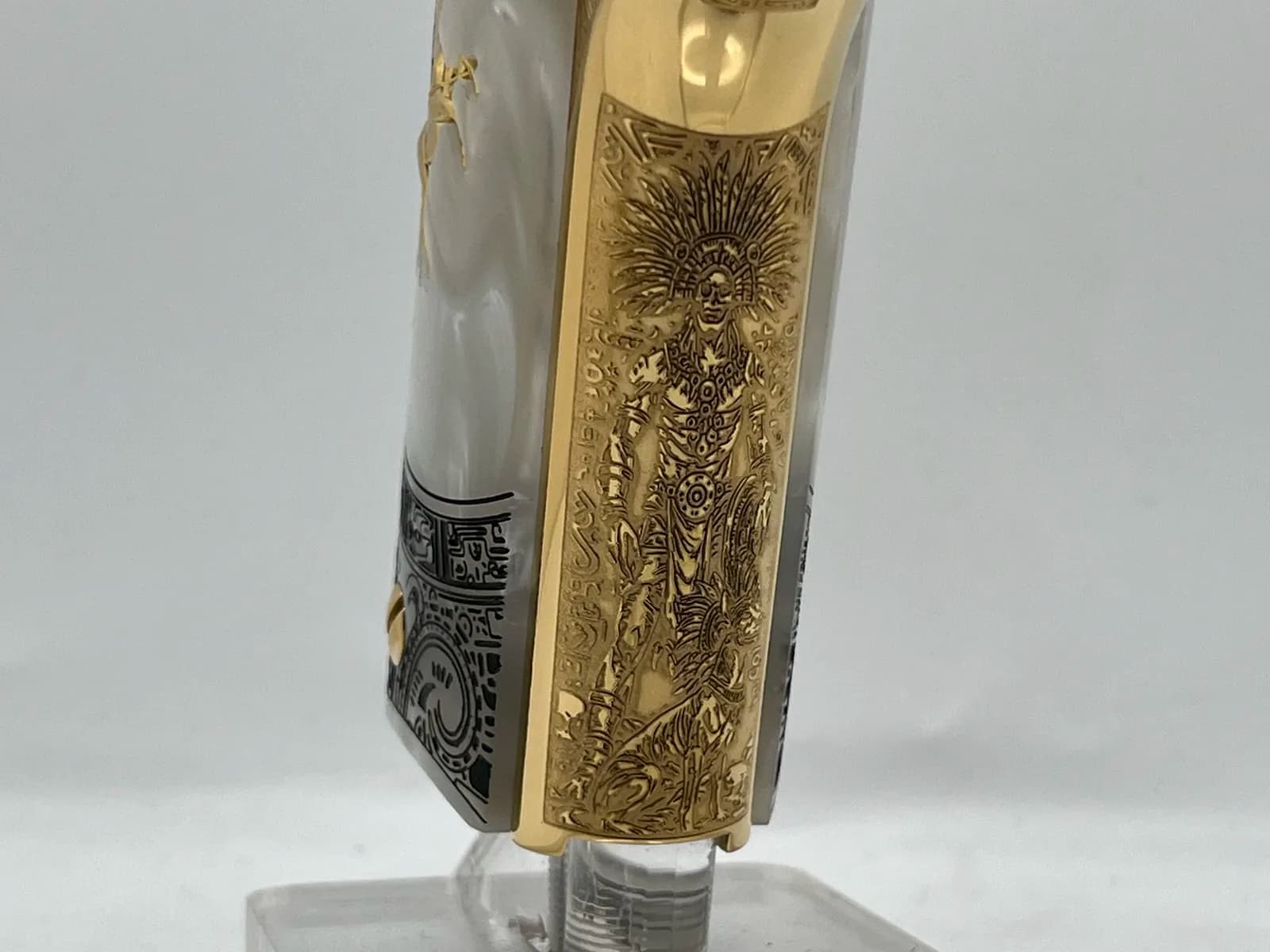 1911 mainspring housing engraved with an Aztec warrior