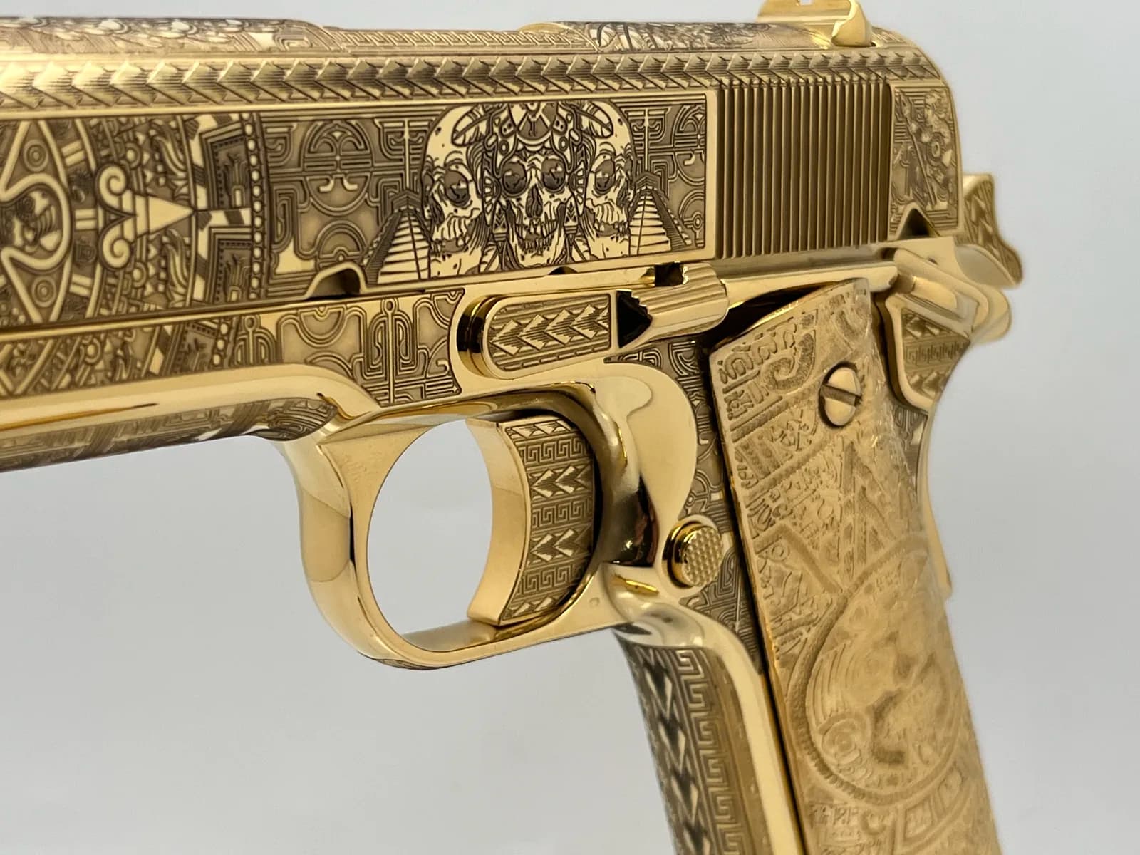 1911 with Aztec calendar and skull engraving, engraved gold grips