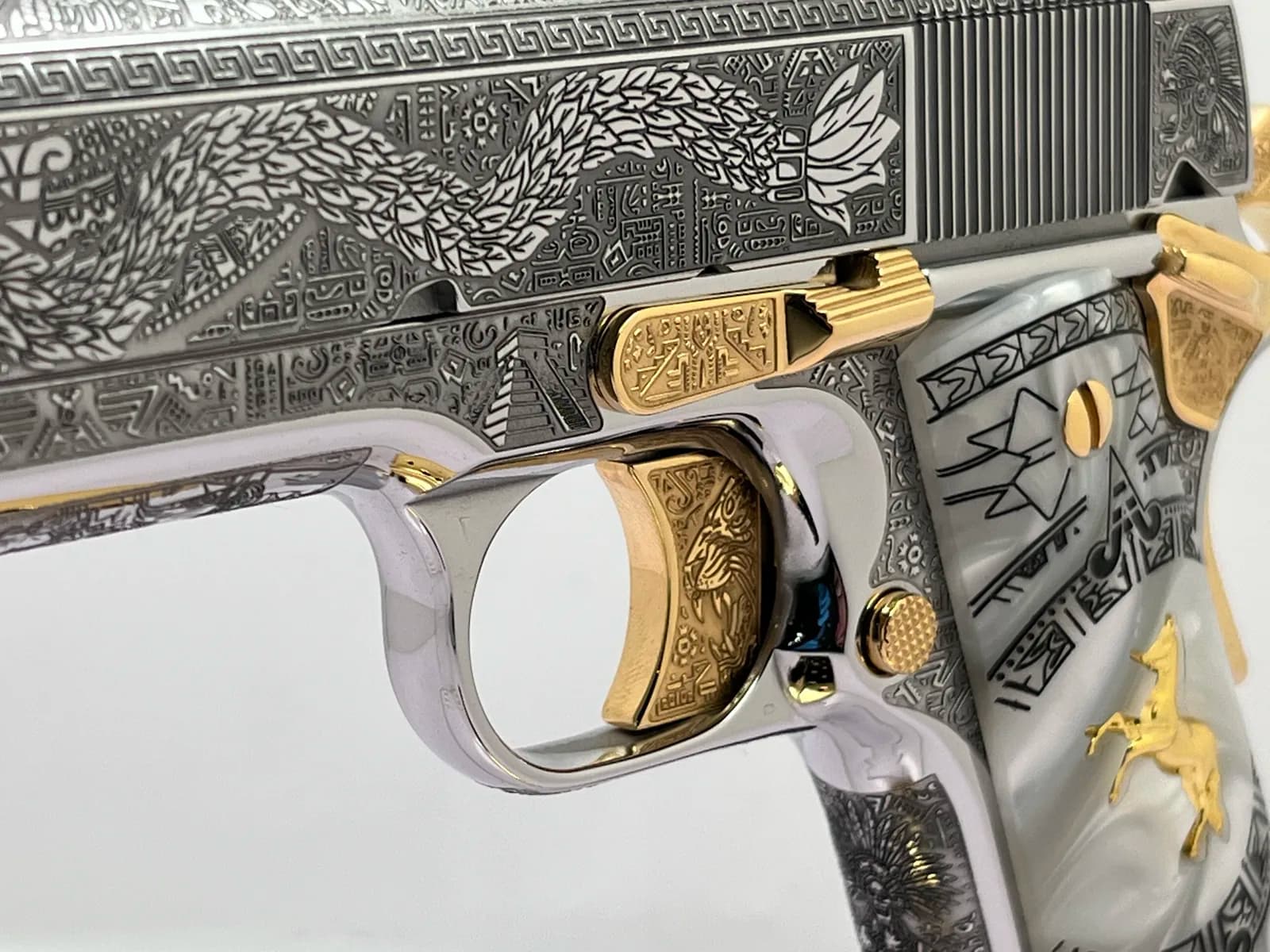1911 with Aztec feathered serpent engraving and pearl grips