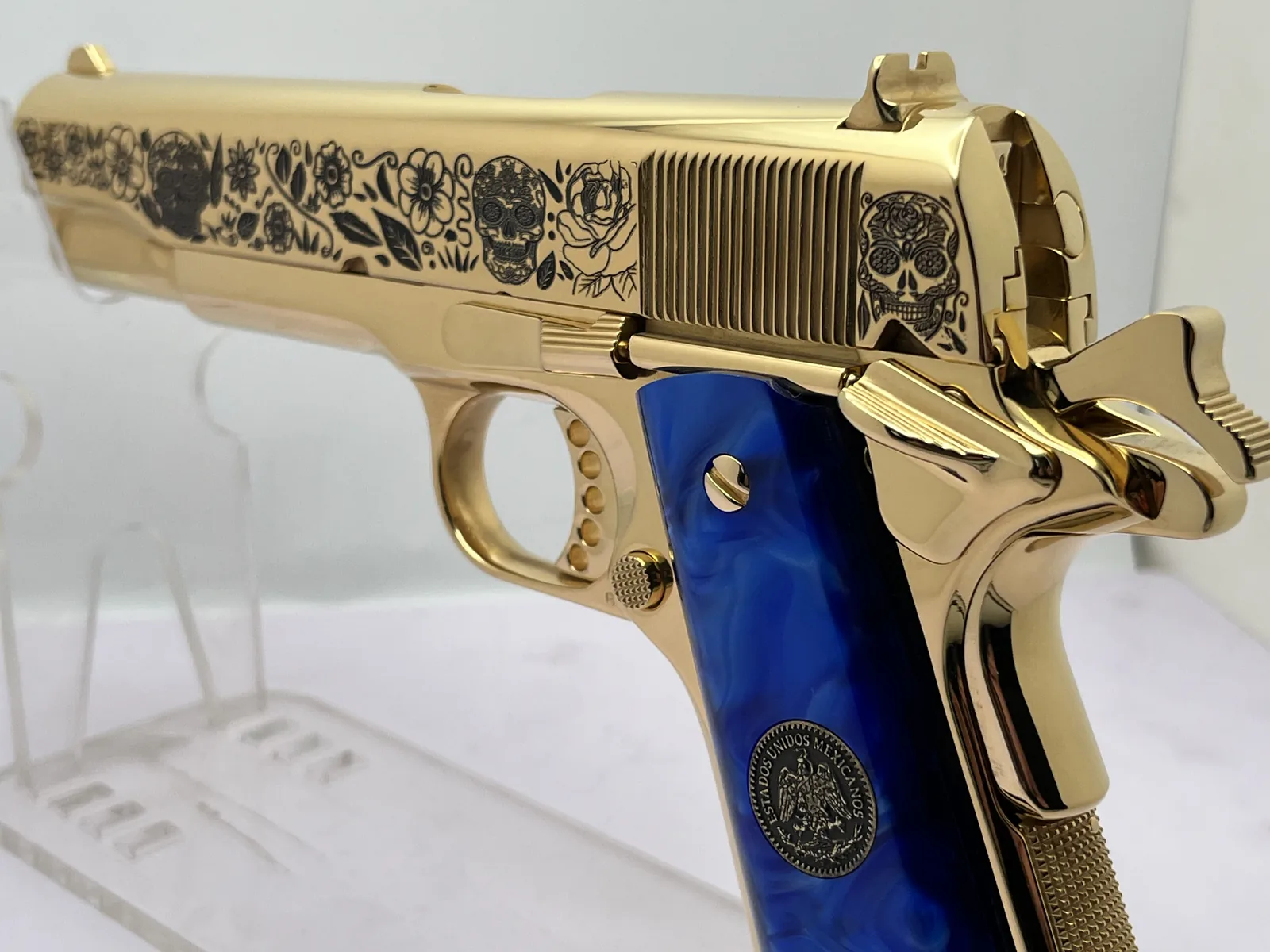 1911 with Dia de los Muertos sugar skull engraving and blue pearl grips