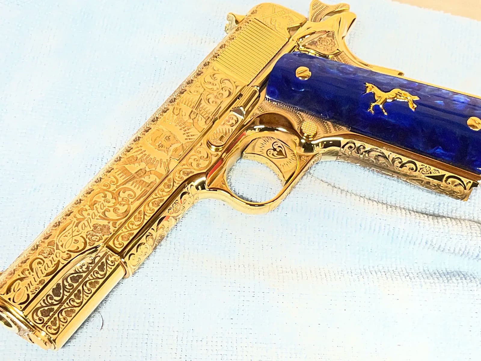 1911 with Emiliano Zapata engraving and blue pearl grips