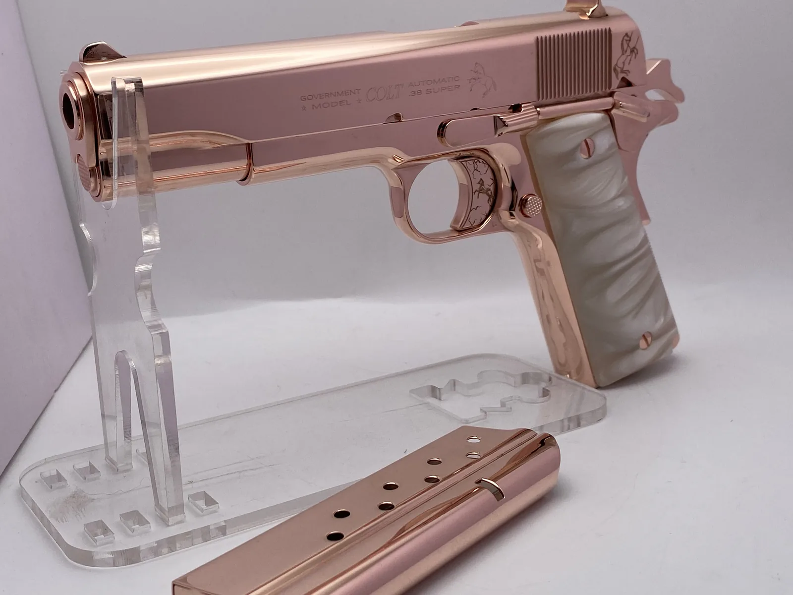 1911 with engraved horse trigger and pearl grips