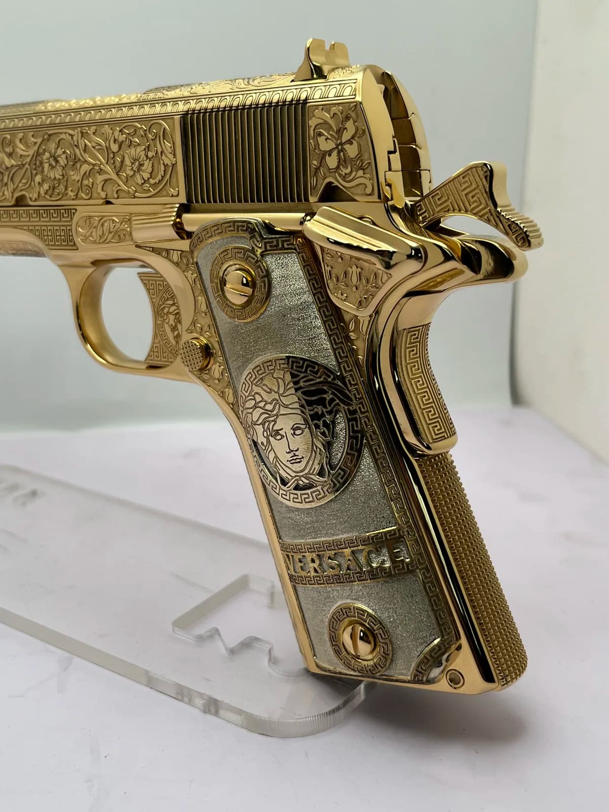 1911 with floral scroll and Greek key engraving, medallion grips