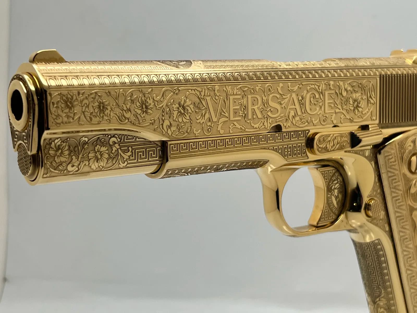 1911 with Greek key and floral engraving, engraved gold grips