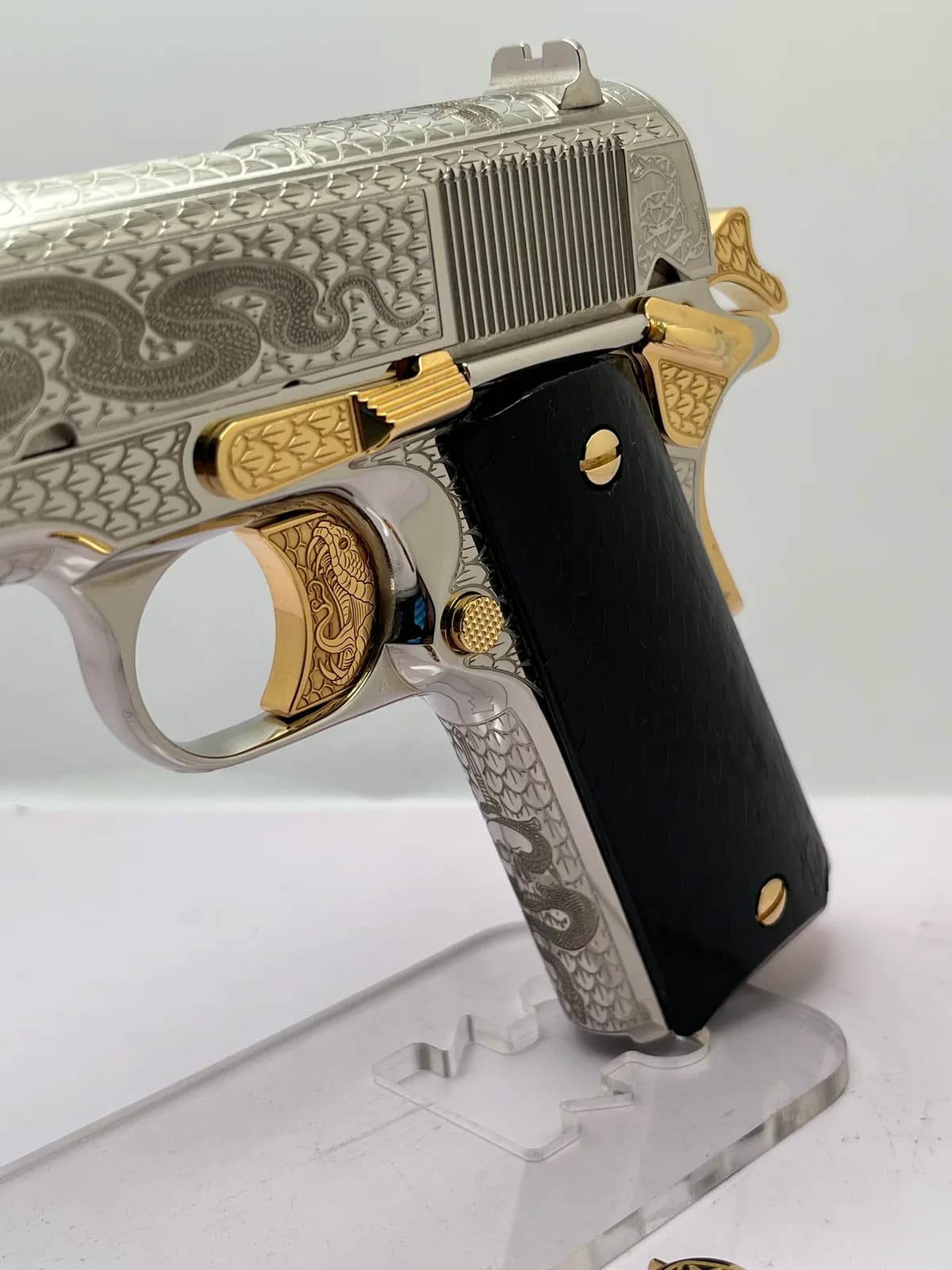 1911 with rattlesnake engraving and black grips