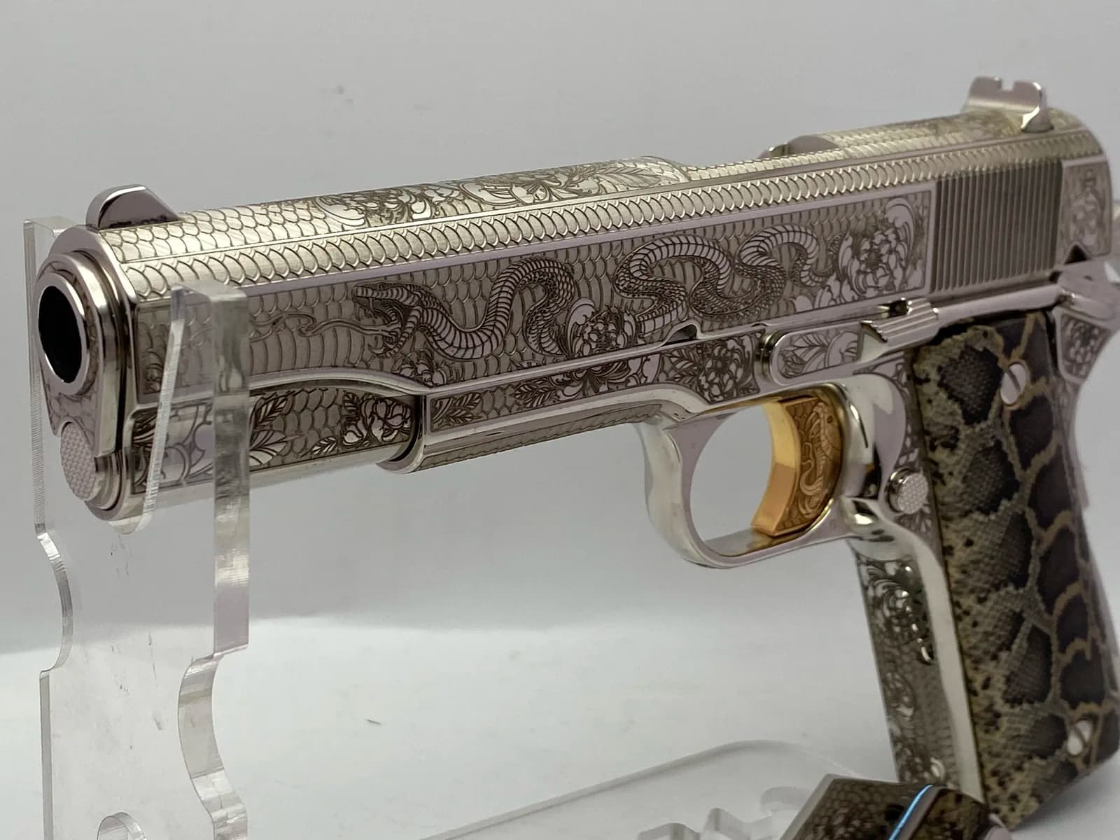 1911 with rattlesnake engraving and snakeskin grips