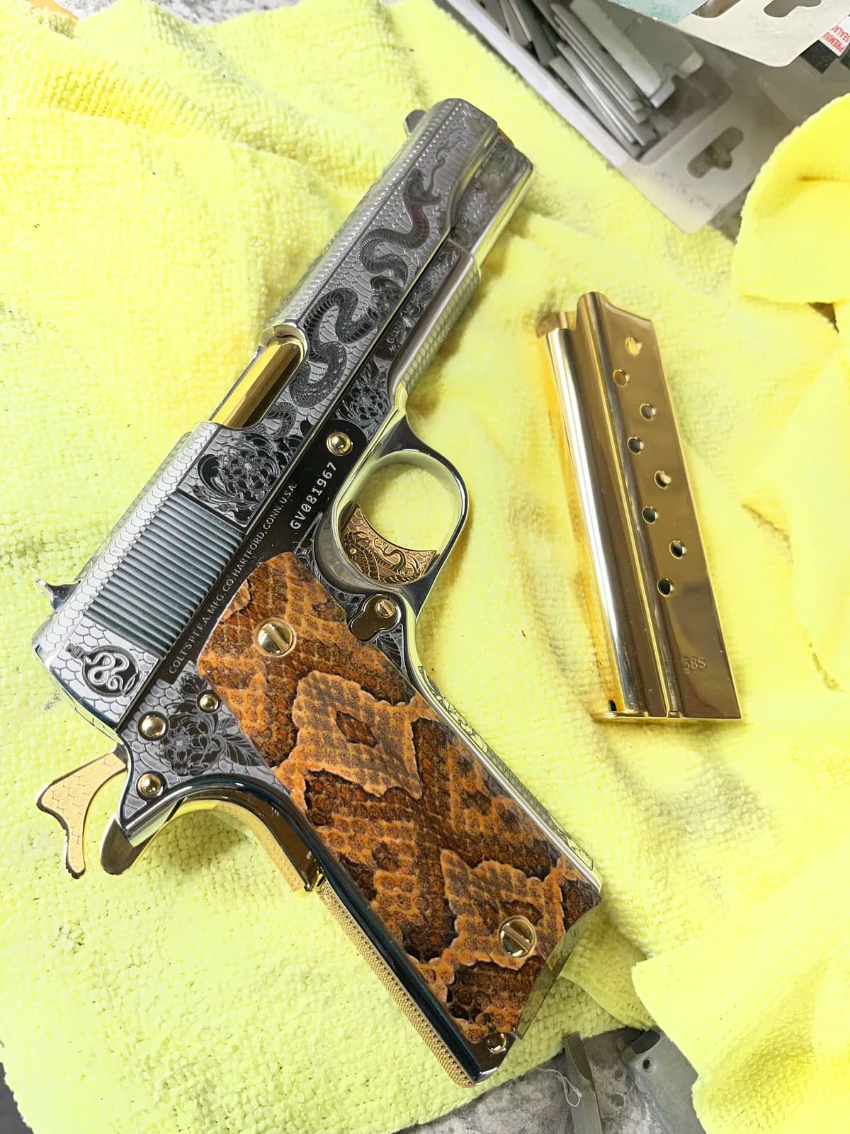 1911 with rattlesnake engraving and snakeskin grips