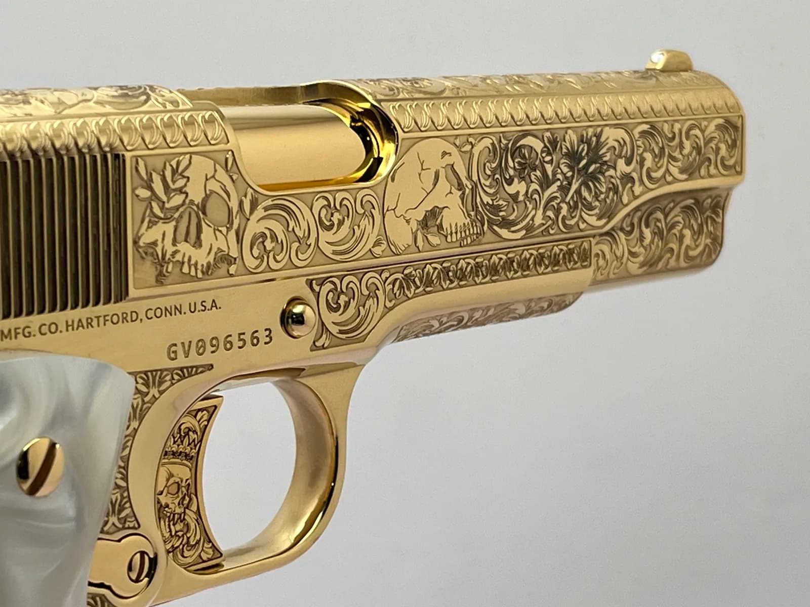 1911 with skull and scroll engraving and pearl grips