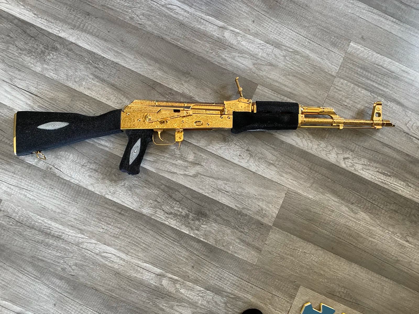 AK-pattern rifle with scroll engraving and stingray stock