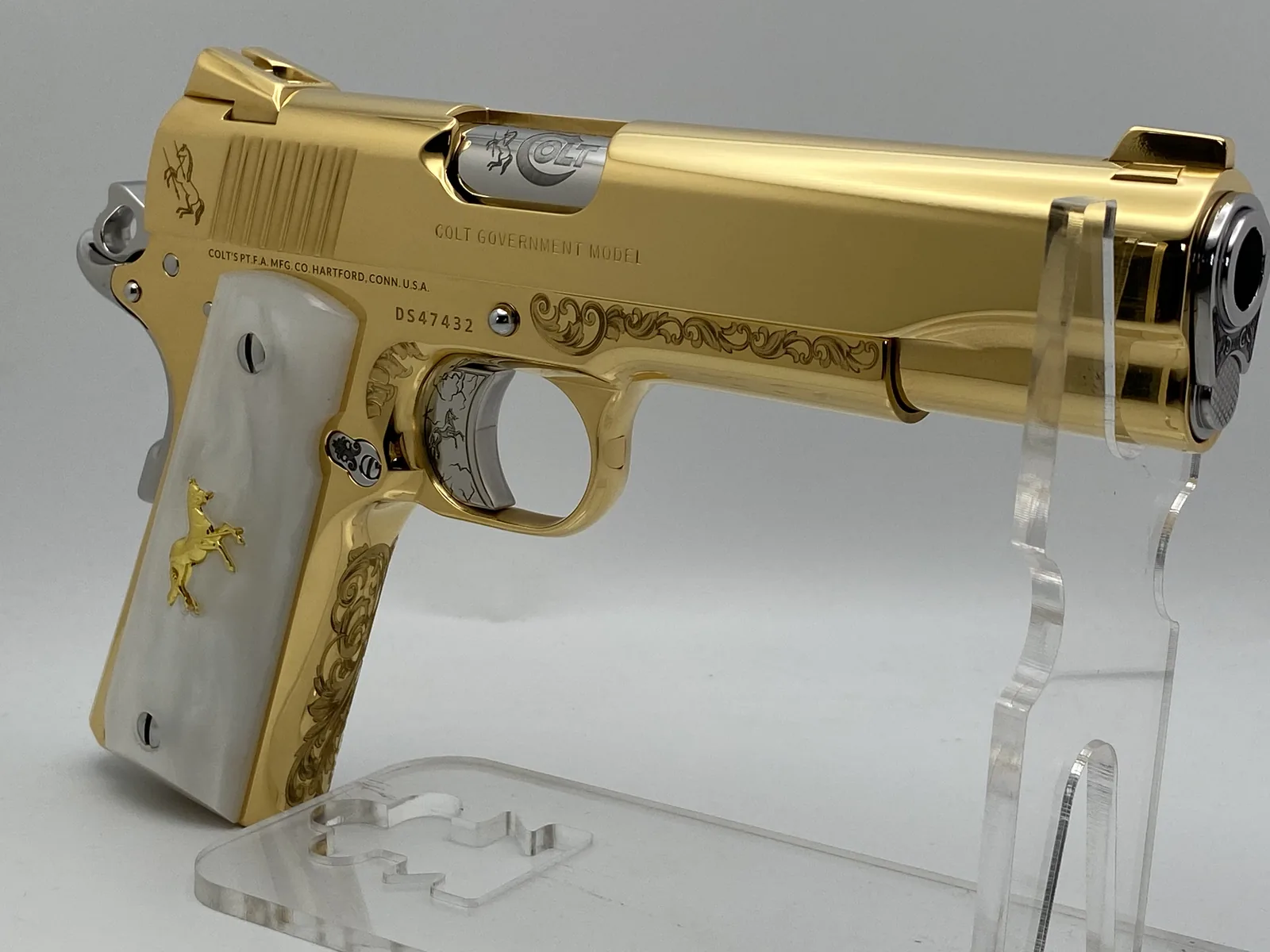 Colt 1911 with scroll engraving and pearl grips