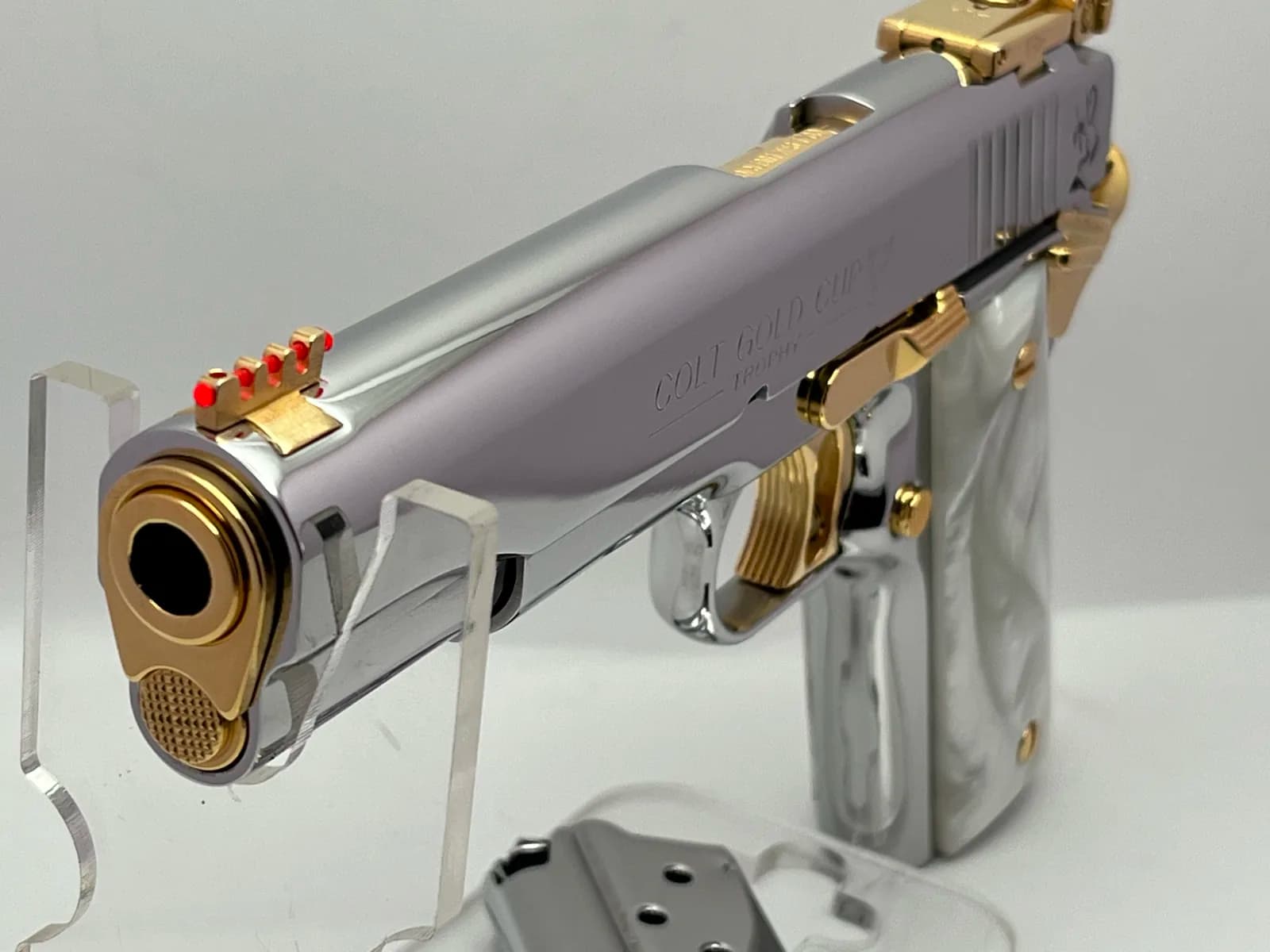 Colt Gold Cup with gold accents and pearl grips