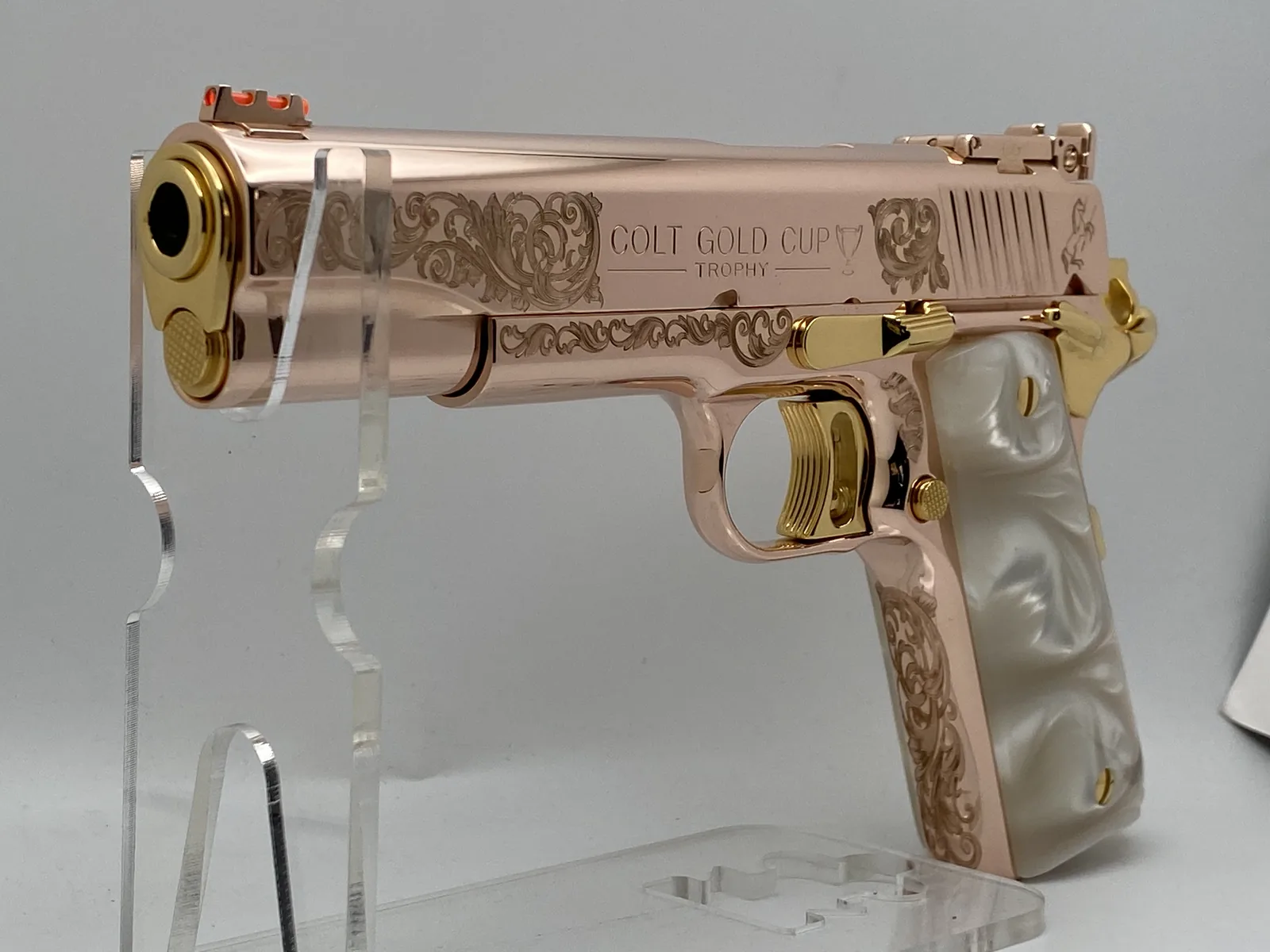 Colt Gold Cup with scroll engraving and pearl grips