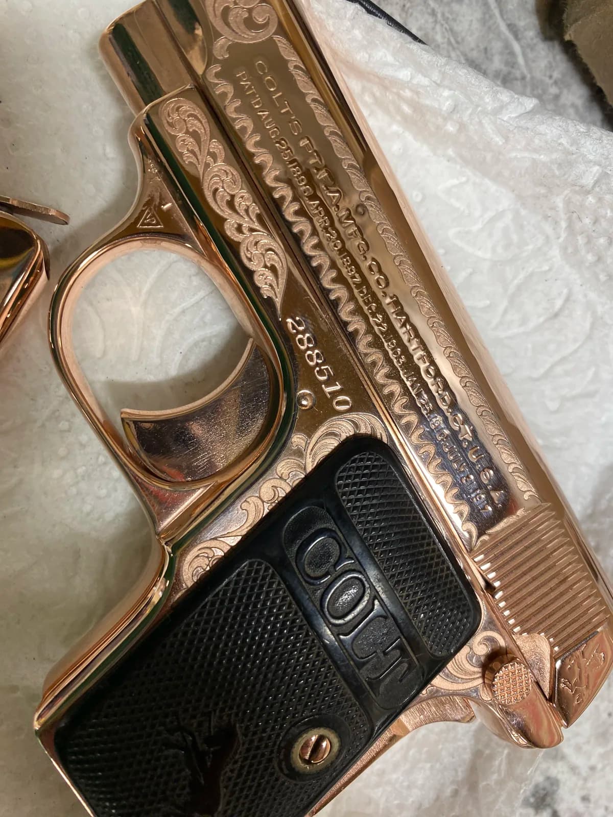 Colt pocket pistol with scroll engraving