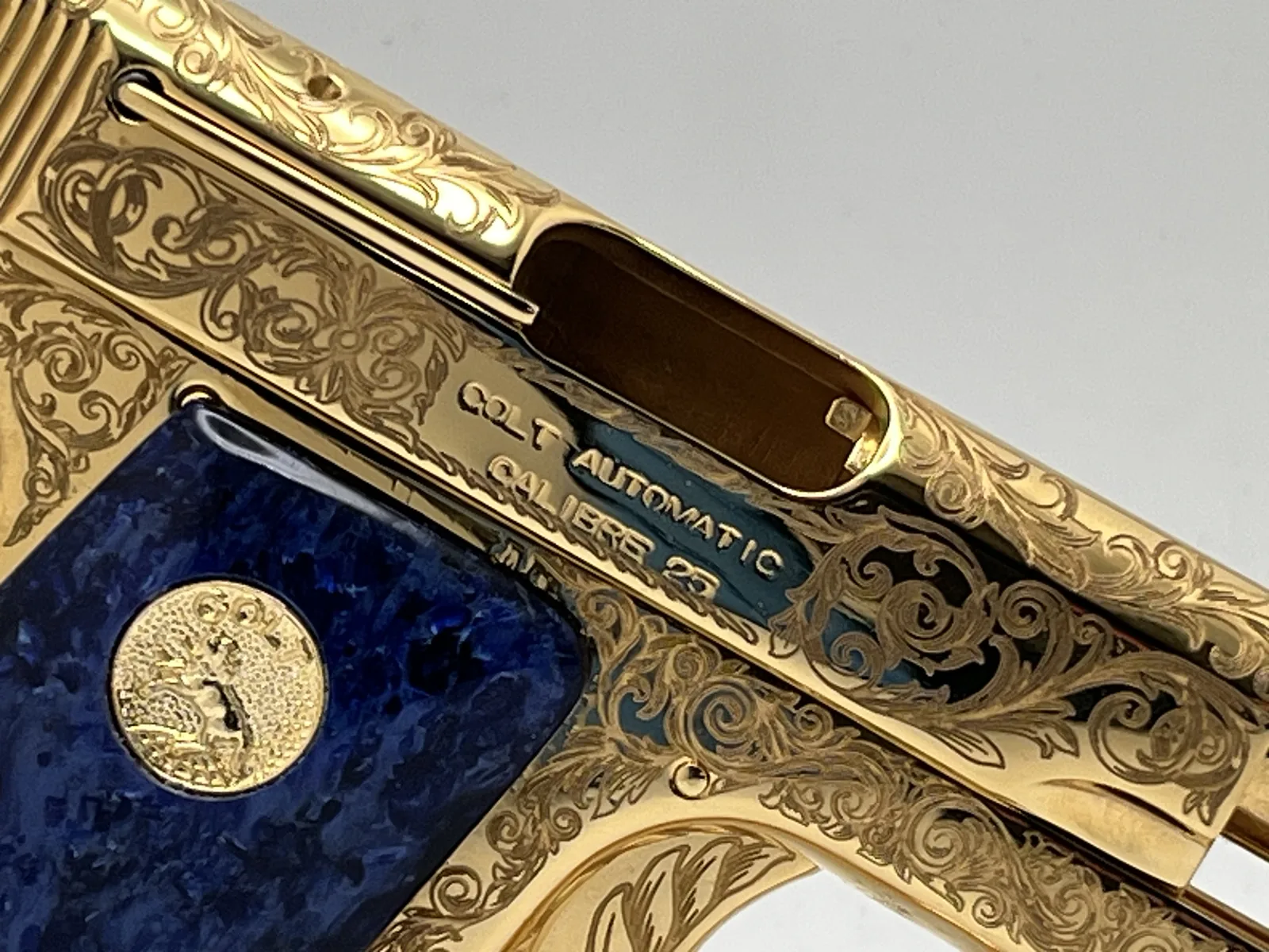Colt pocket pistol with scroll engraving and blue grips
