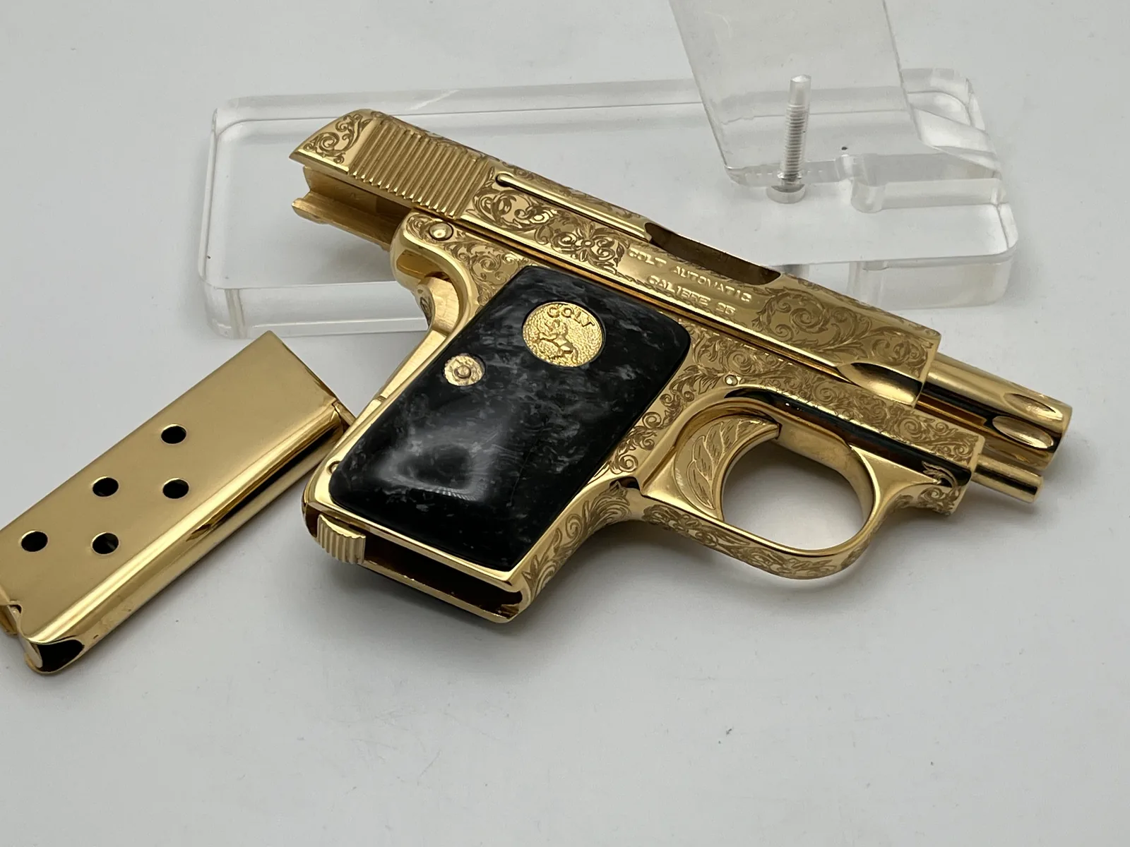 Colt pocket pistol with scroll engraving and marble grips