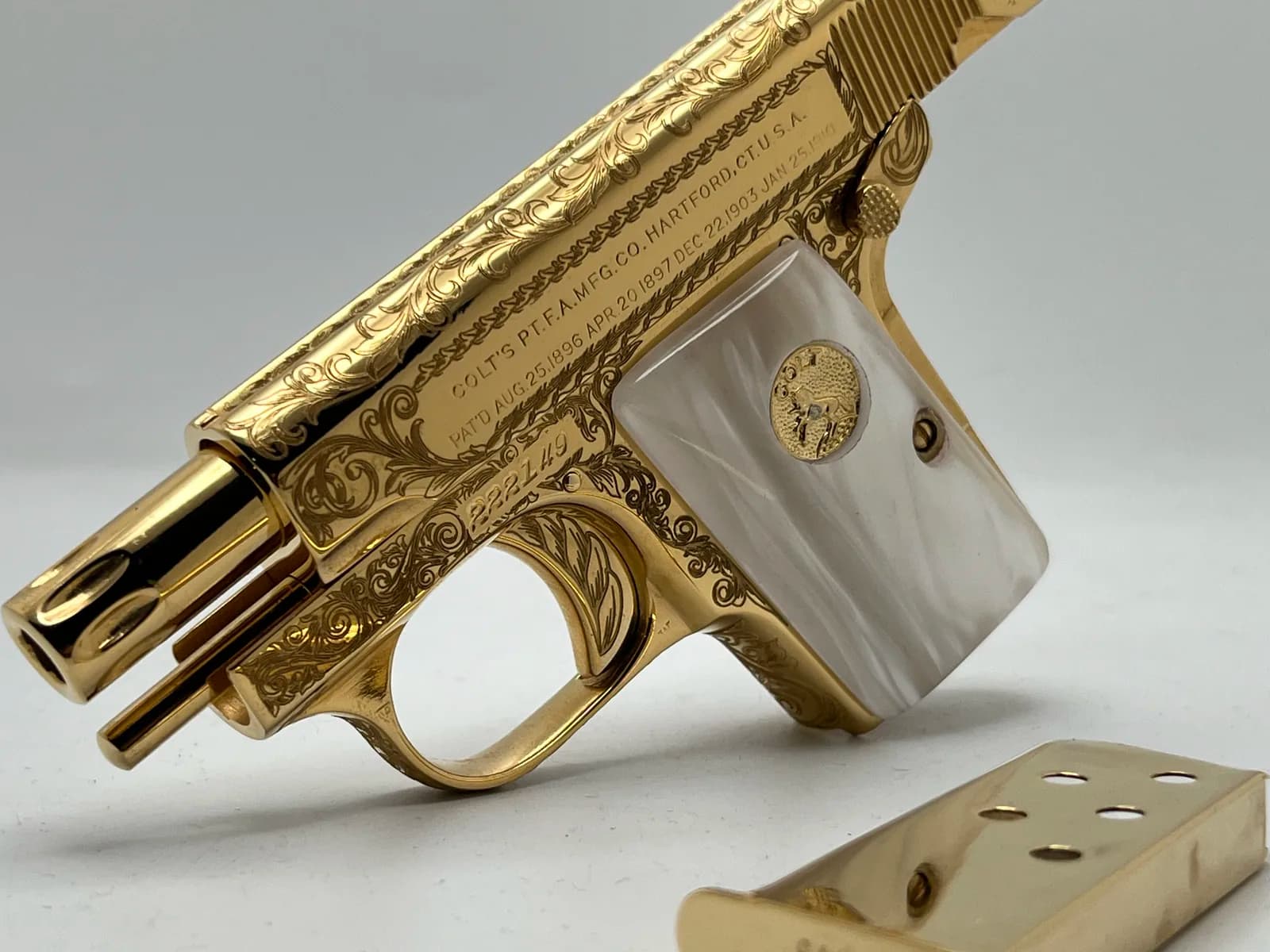Colt pocket pistol with scroll engraving and pearl grips