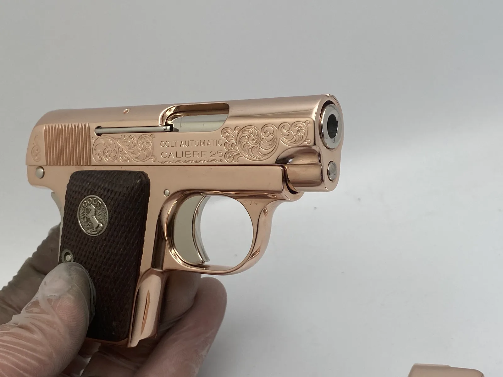 Colt pocket pistol with scroll engraving