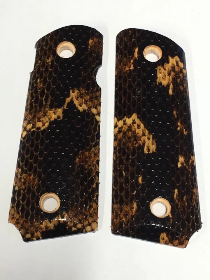 Compact ambi-cut 1911 pistol grips wrapped in broad banded water snakeskin