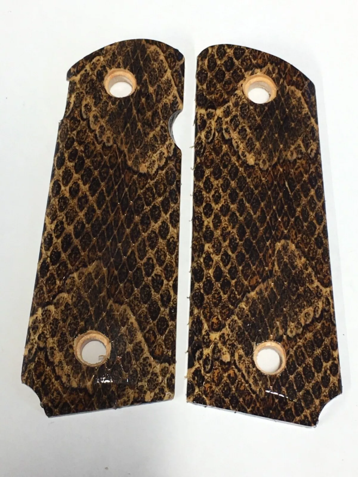 Compact ambi-cut 1911 pistol grips wrapped in copperhead snakeskin