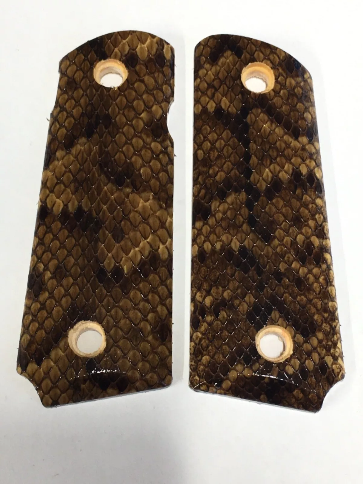 Compact ambi-cut 1911 pistol grips wrapped in cottonmouth snakeskin
