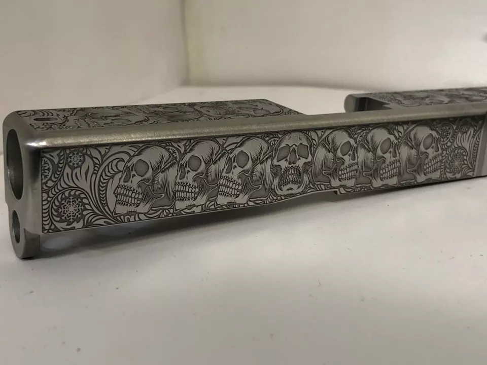 Deep laser engraved brushed stainless Glock 19 slide Gen 3 skulls themed