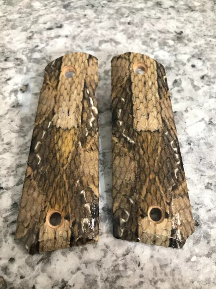 Full-size 1911 ambi-cut pistol grips wrapped in gaboon viper snakeskin