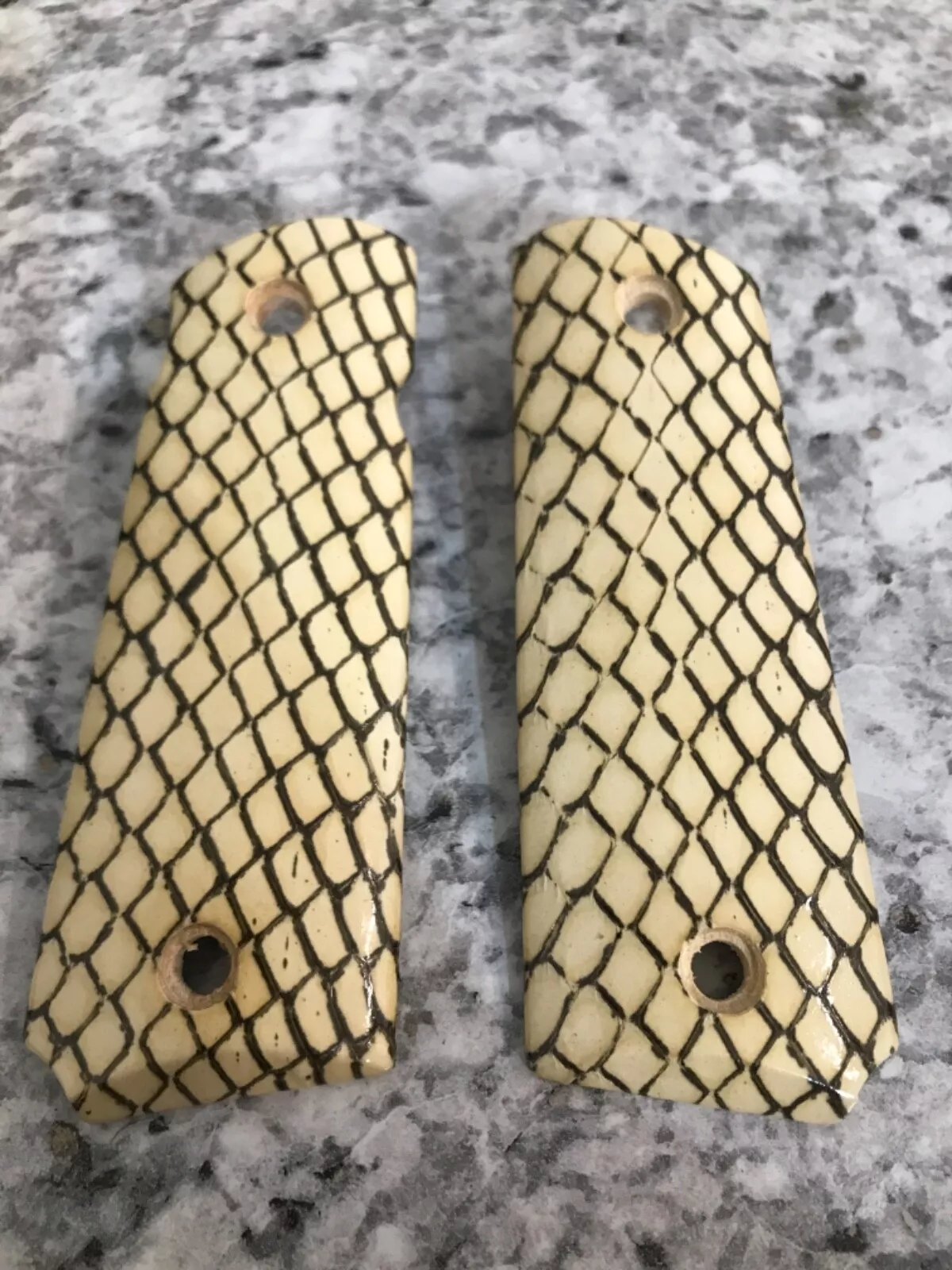 Full-size 1911 ambi-cut pistol grips wrapped in white cobra snakeskin