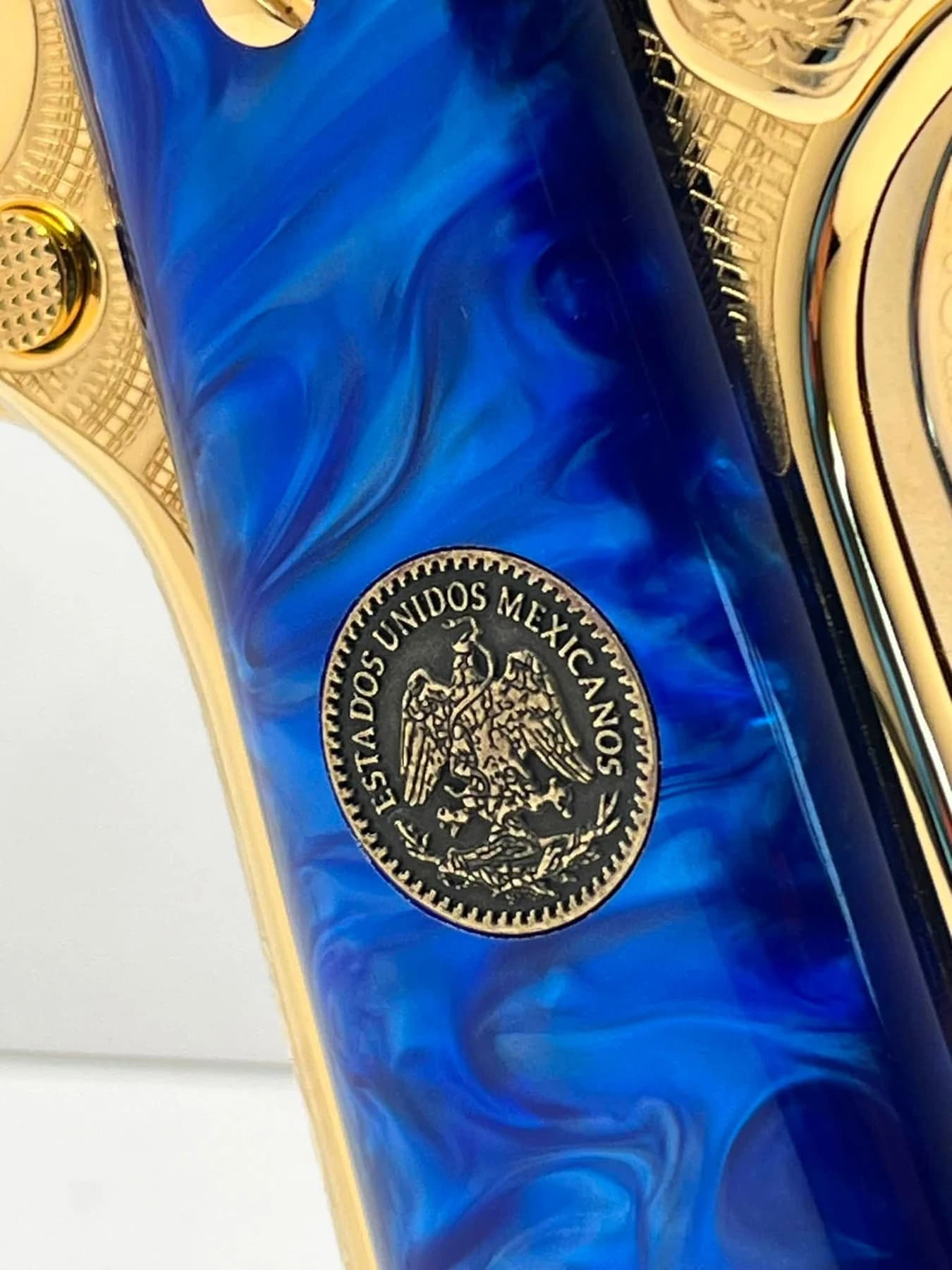 24k gold Colt Super .38, Pancho Villa edition: blue pearlized grip and peso