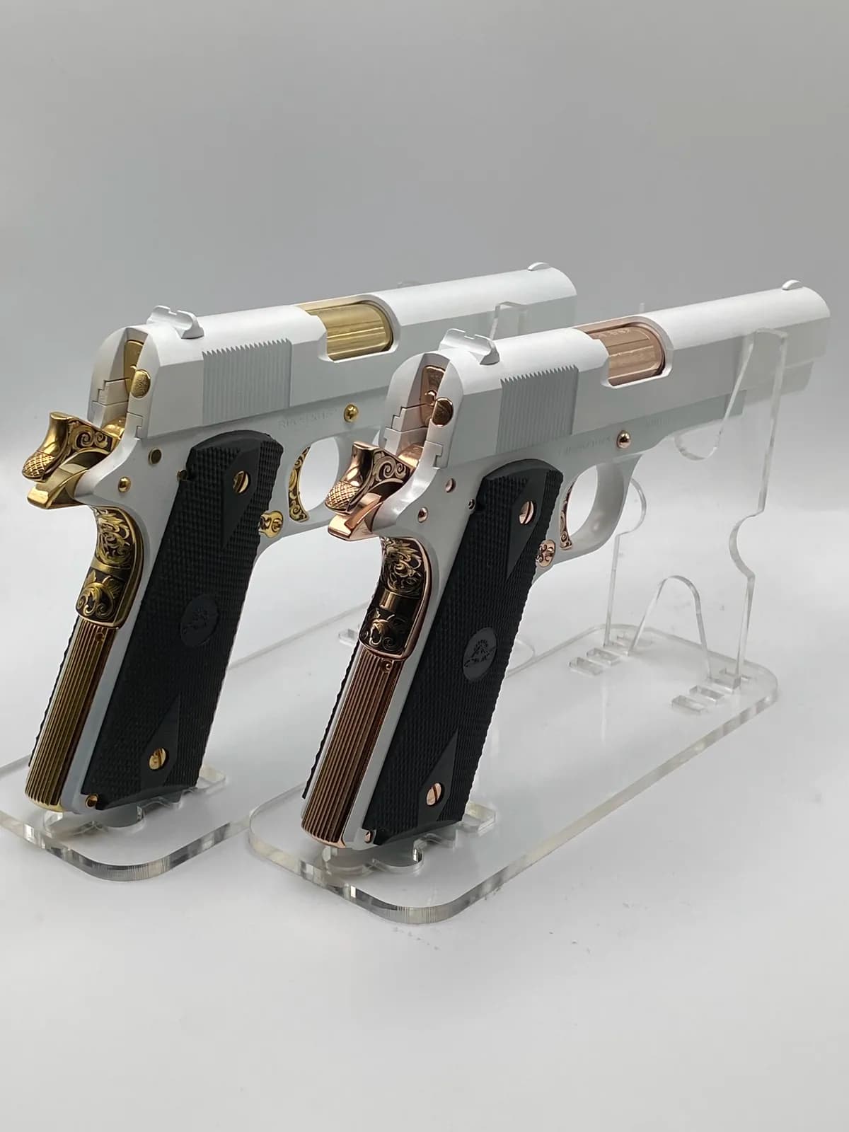 Two 1911s in white with gold and rose gold accents